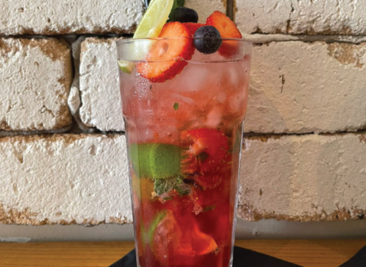 Glass filled with fruit and ice